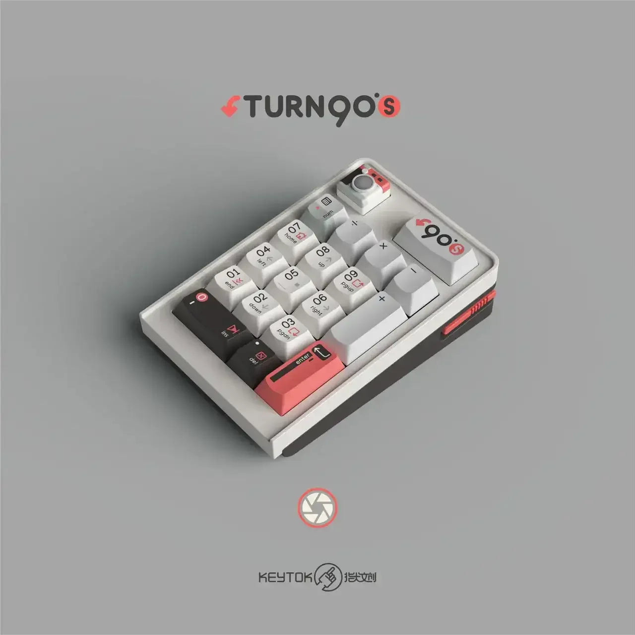 Mechaniczny numpad w kolorach szarości, czerwieni i czerni, z unikalnymi keycapami, idealny do biura.