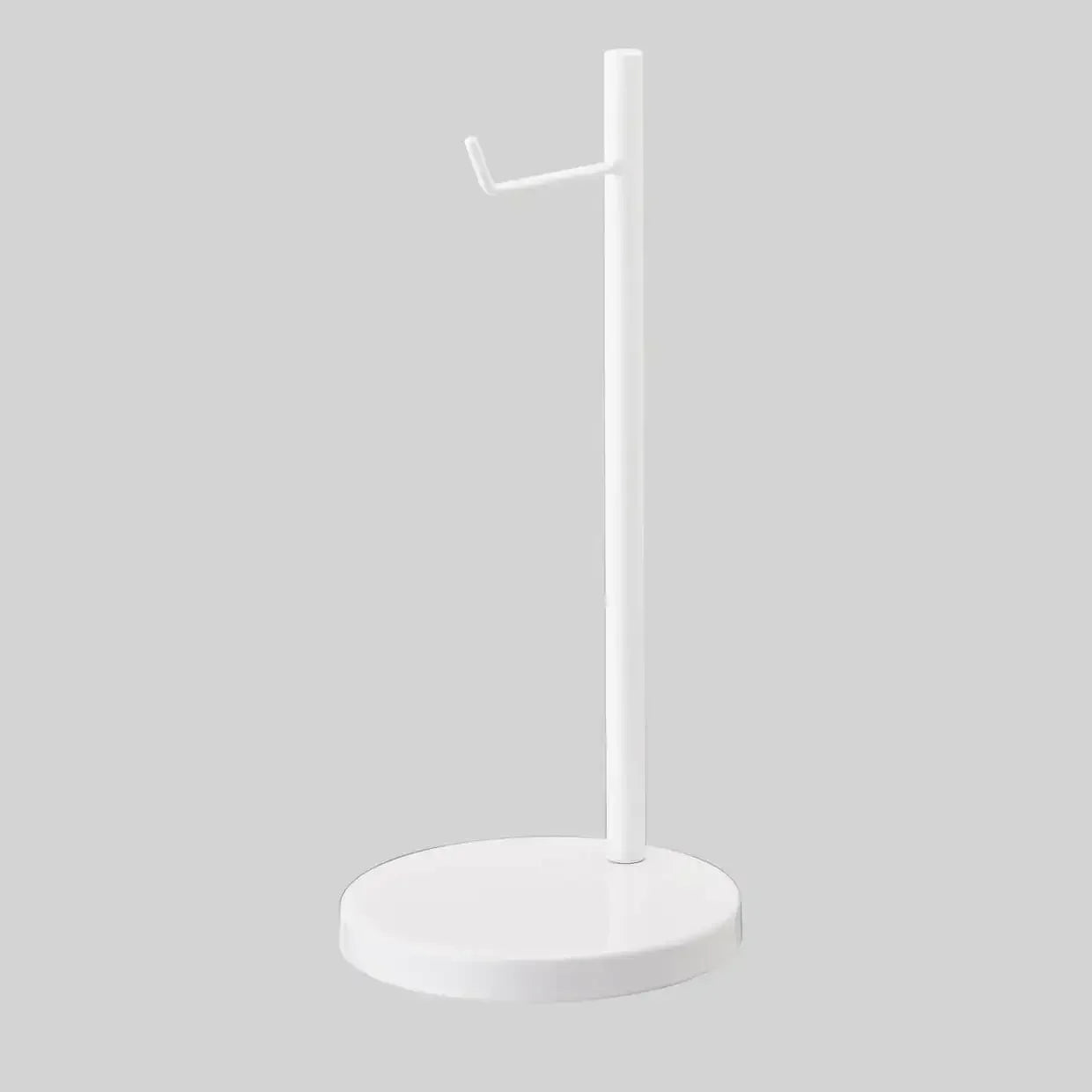 Biały stojak na słuchawki, minimalistyczny design, akcesorium biurowe na biurko