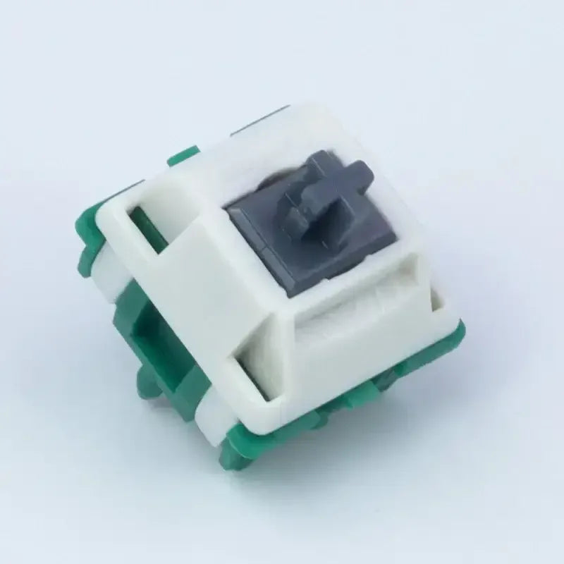 Przełącznik mechaniczny do klawiatury, biało-zielony switch na białym tle