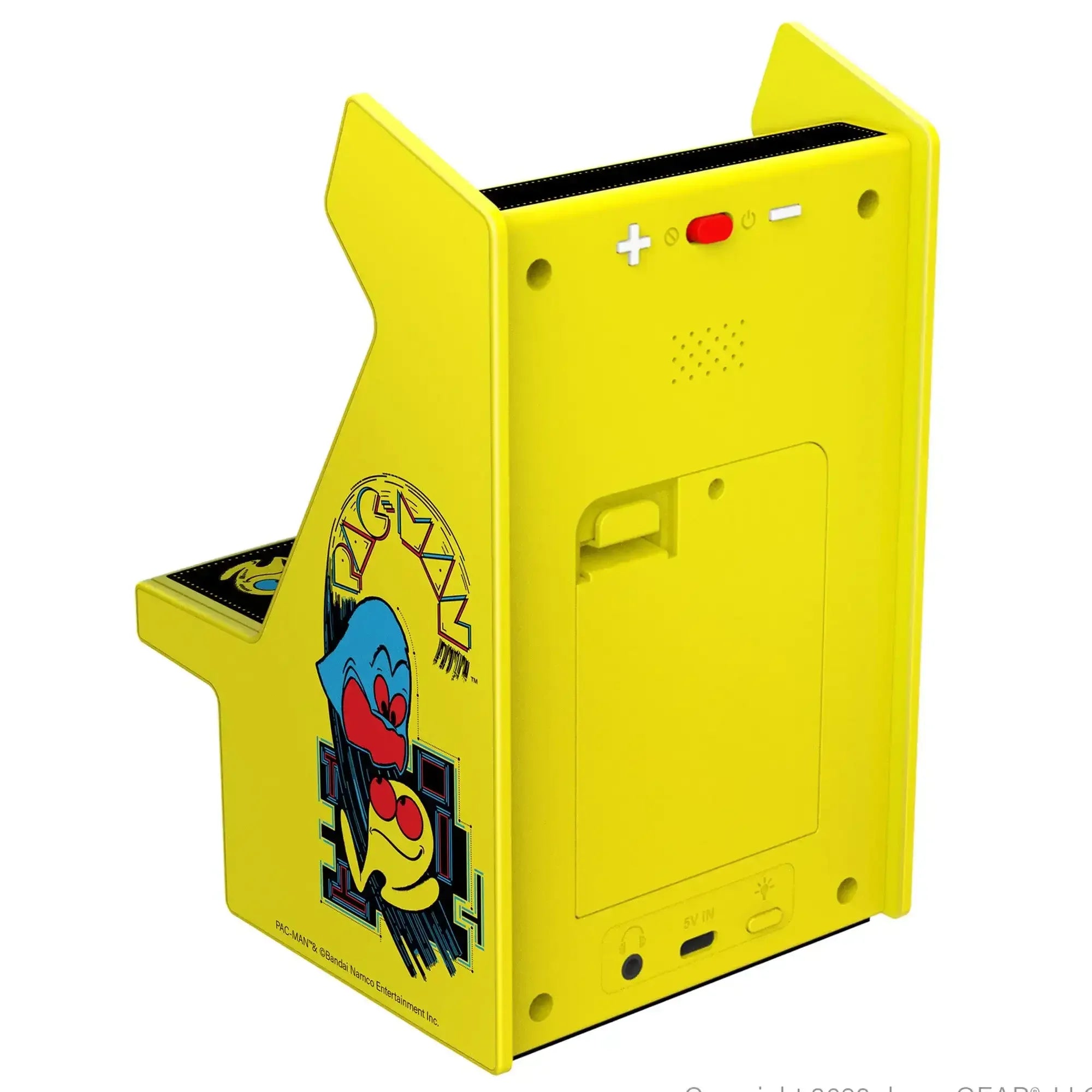 Żółta miniaturowa konsola arcade z grafiką Pac-Mana, dekoracja do biura lub home office.