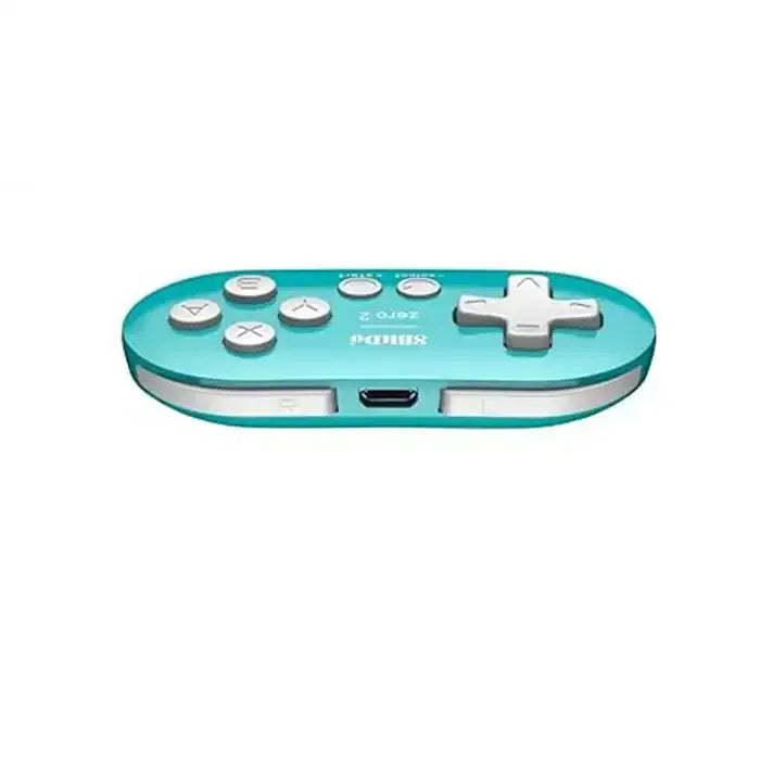Turkusowy bezprzewodowy gamepad z białymi przyciskami, akcesorium biurowe do desk setupu