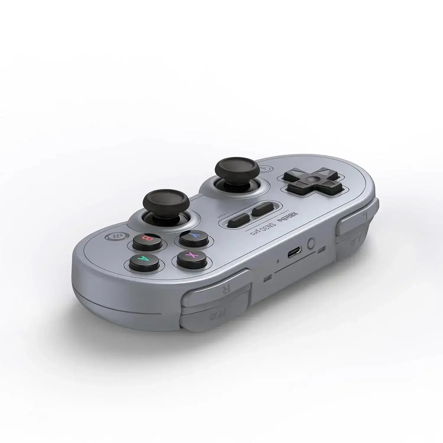 Bezprzewodowy szary gamepad retro z joystickami i przyciskami do komputera i konsoli