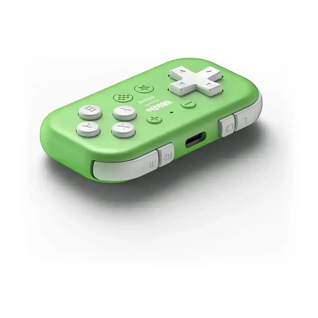 zielony mini kontroler do gier z białymi przyciskami i portem USB, akcesorium biurowe