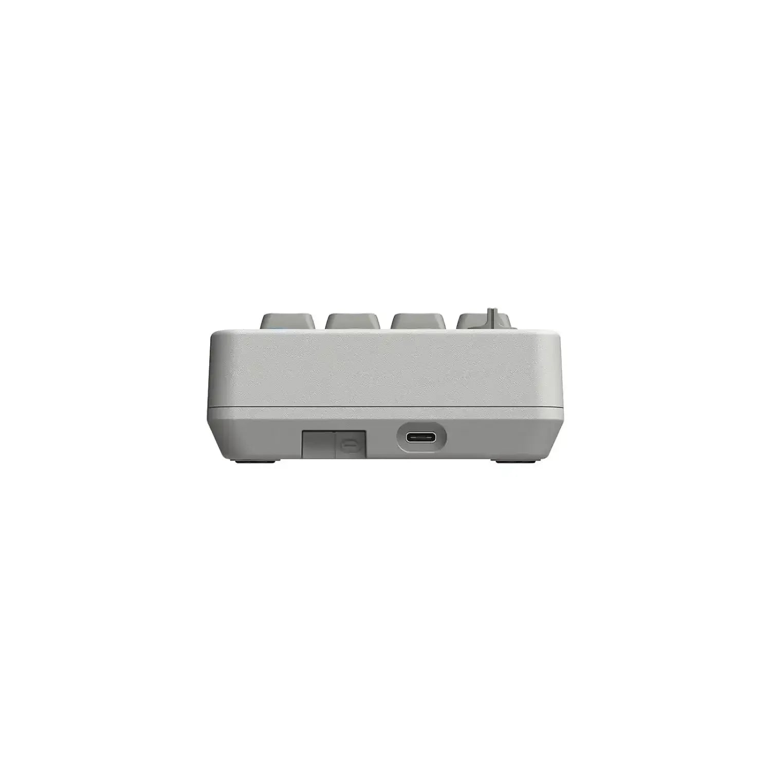 Szary mechaniczny numpad z portem USB-C, widok z boku, minimalistyczny design