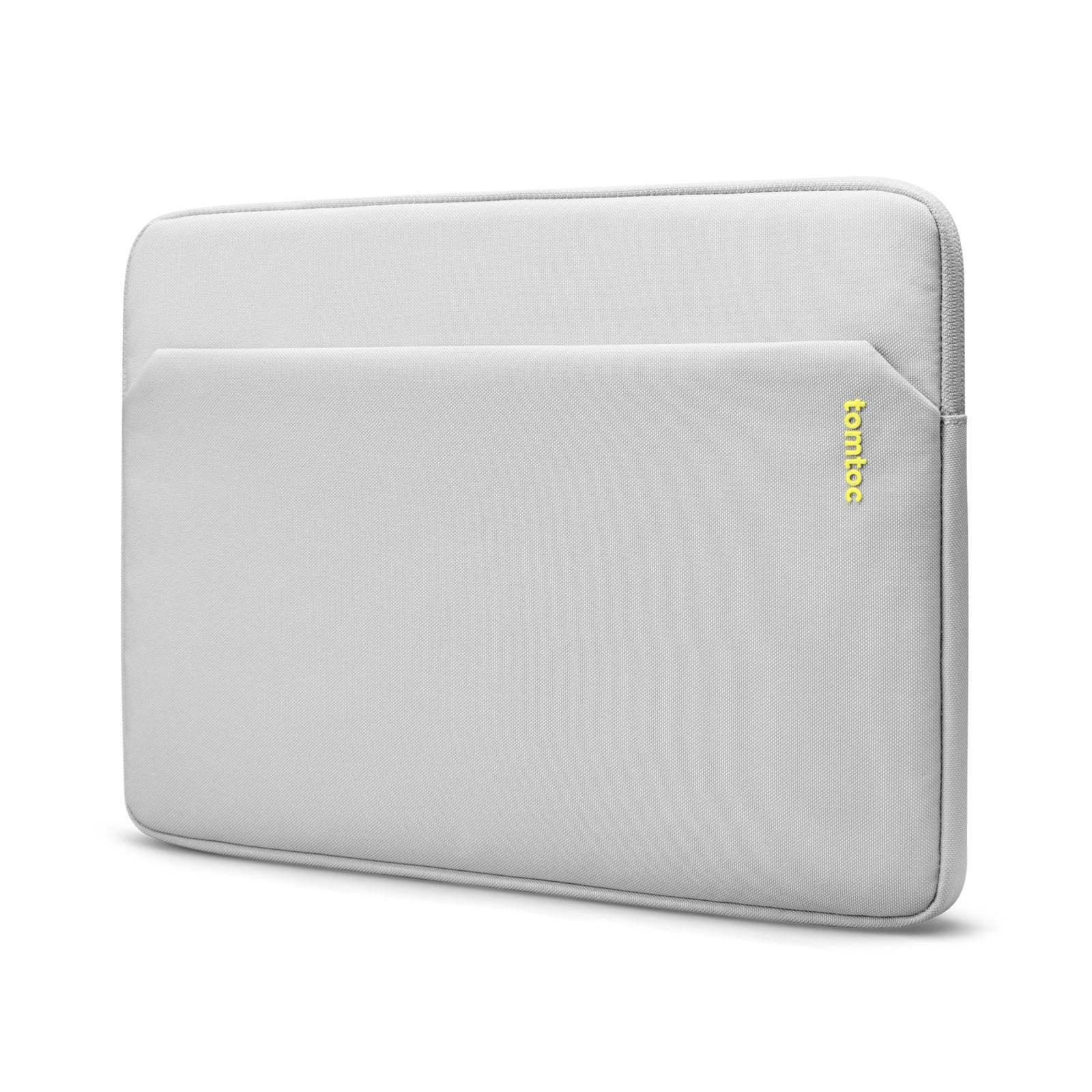 Szara torba na laptopa z kieszenią boczną, minimalistyczny design, etui ochronne.