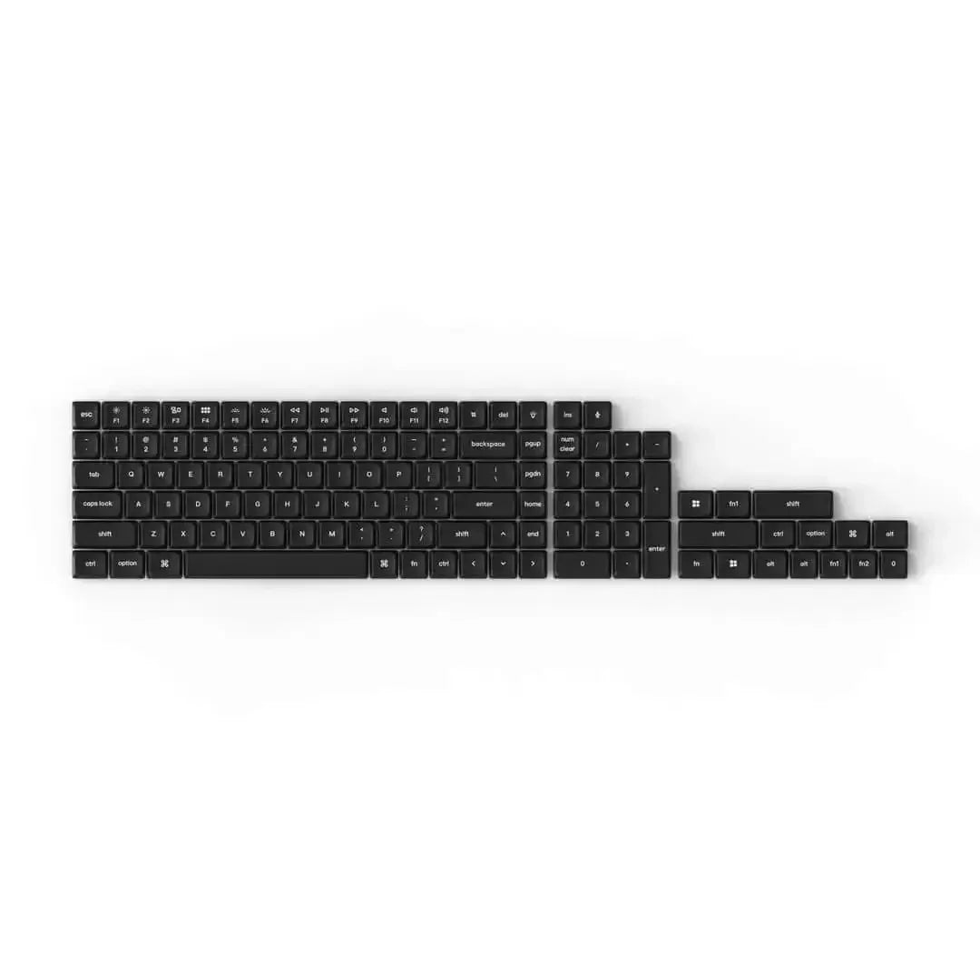 Czarny zestaw keycapów PBT low-profile do klawiatury mechanicznej na białym tle.