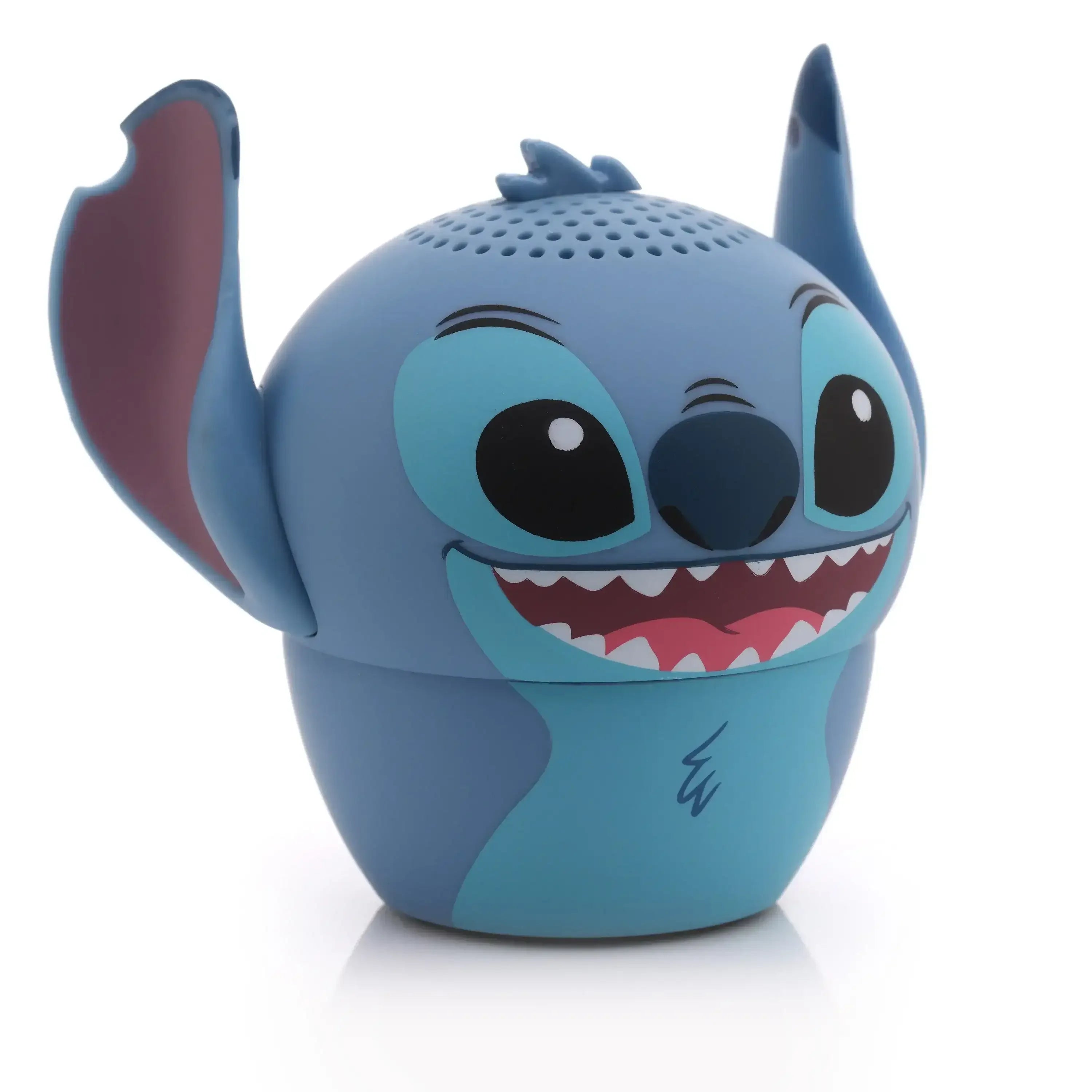 Niebieski głośnik Bluetooth w kształcie postaci z kreskówki, idealny akcesorium do biura.