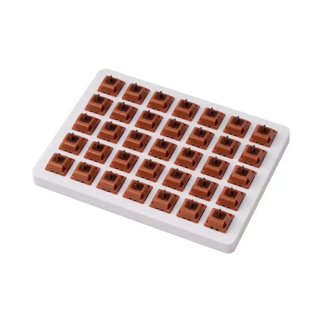 Brązowe switche Gateron Cap Golden Brown do klawiatury mechanicznej na białej tacce