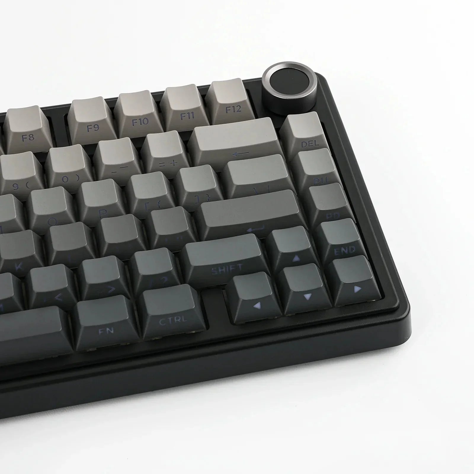 Szara klawiatura mechaniczna z przyciskiem rotacyjnym, idealna do home office i personalizacji desk setupu.