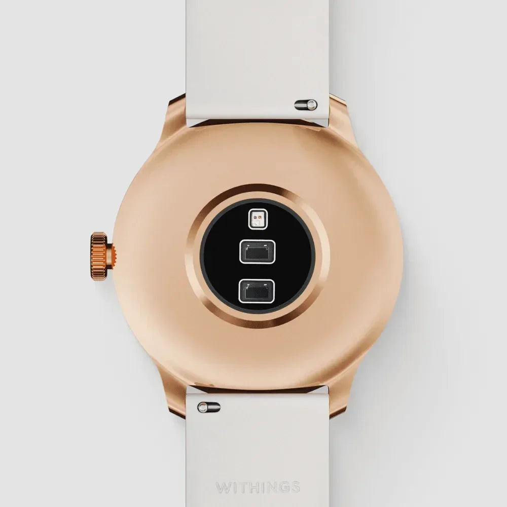 Złoty zegarek Withings z białym paskiem, widok od tyłu z czujnikami