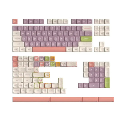 Zestaw pastelowych keycapów do klawiatury mechanicznej z motywami zwierzątek i roślinnymi.
