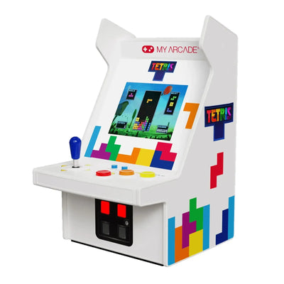 Biała mini konsola arcade Tetris z kolorowymi przyciskami i joystickiem, motyw bloków.