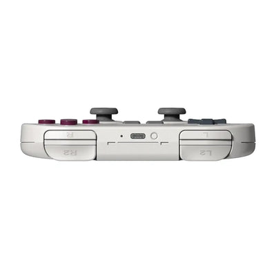 Szary kontroler do gier z przyciskami L1, L2, R1, R2 oraz portem USB-C, widok z góry