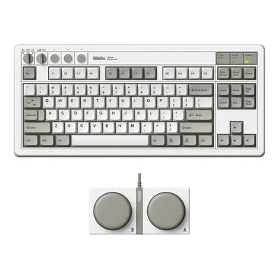 mechaniczna klawiatura retro w kolorze szarym z dużymi pokrętłami i panel sterujący, akcesorium do biura