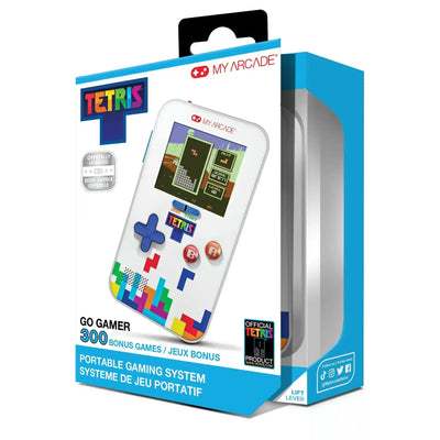 Konsola przenośna do gier Tetris, biała obudowa, kolorowe klocki, opakowanie produktowe.