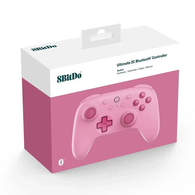 Różowy bezprzewodowy kontroler Bluetooth do gier na Switch, zapakowany w pudełko.