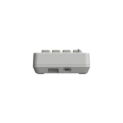 Szary mechaniczny numpad z portem USB-C, widok z boku, minimalistyczny design