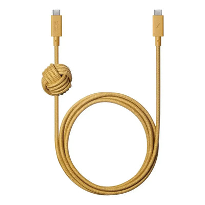 Żółty kabel USB-C do USB-C w oplocie, z ozdobnym węzłem, akcesorium biurowe.