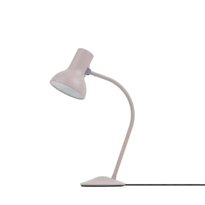 Nowoczesna, różowa lampka biurkowa na białym tle, ergonomiczne oświetlenie do biura