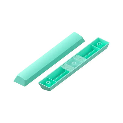 Miętowy keycap do klawiatury mechanicznej, widoczna górna i dolna część na białym tle