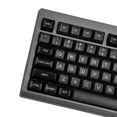 Czarna klawiatura mechaniczna z białymi klawiszami, nowoczesny design biurowy