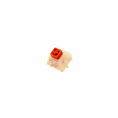 Czerwony switch mechaniczny Kailh Red Bean Pudding do klawiatury na białym tle
