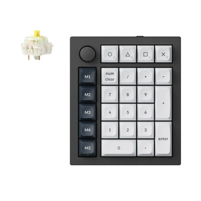 Czarna aluminiowa klawiatura numeryczna mechaniczna z pokrętłem i białymi klawiszami, widoczny żółty switch.