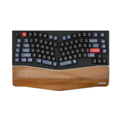 Ergonomiczna klawiatura mechaniczna z drewnianą podpórką pod nadgarstki, układ split, keycapy w odcieniach czerni i granatu.
