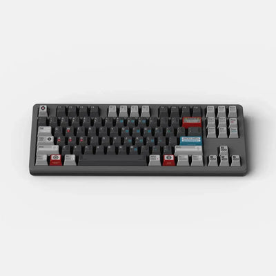 Klawiatura mechaniczna w kolorze czarnym i szarym z kolorowymi keycapami, biurowe akcesorium.