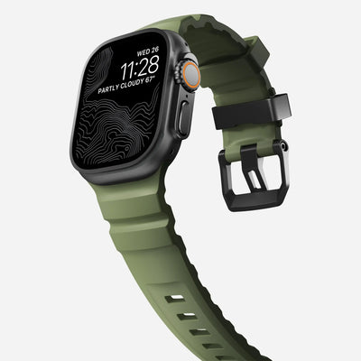 Zielony silikonowy pasek do Apple Watch, nowoczesny design, widok z boku na zegarek