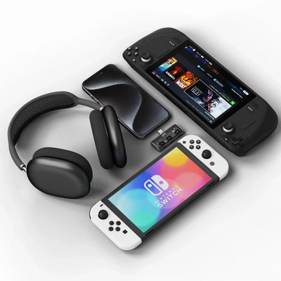 Zestaw: słuchawki bezprzewodowe, telefon, konsola Nintendo Switch, adapter audio, konsola przenośna.