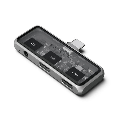 Kompaktowy hub USB-C z wyjściem audio, portami i przezroczystą obudową na biurko