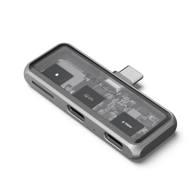 Nowoczesny hub USB-C z portami i slotem na kartę microSD, przezroczysta obudowa, akcesorium biurowe