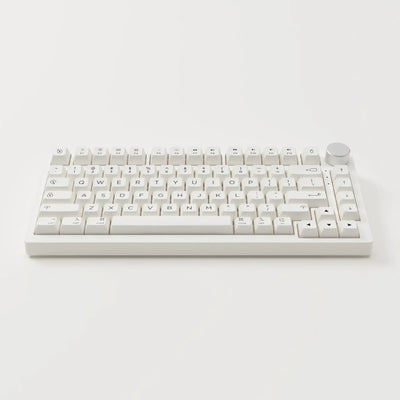 biała klawiatura mechaniczna z gałką, minimalistyczny design, akcesoria biurowe
